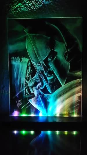 Retrato LED terminado, iluminado en verde y azul